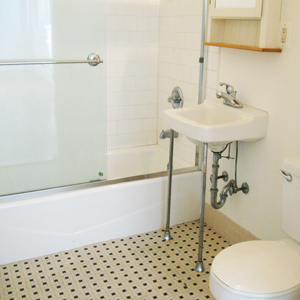 ceramic tile bathroom in loft 4I at the ballroom in 318 grand street brooklyn ny