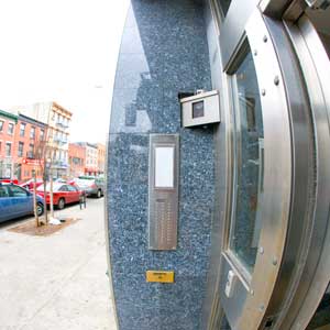 front door with intercom and digital  security camera